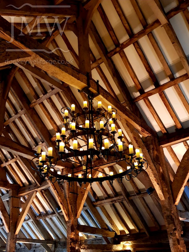 wrought-iron-chandelier-tithe-barn-wedding-venue-donkeywell-forge