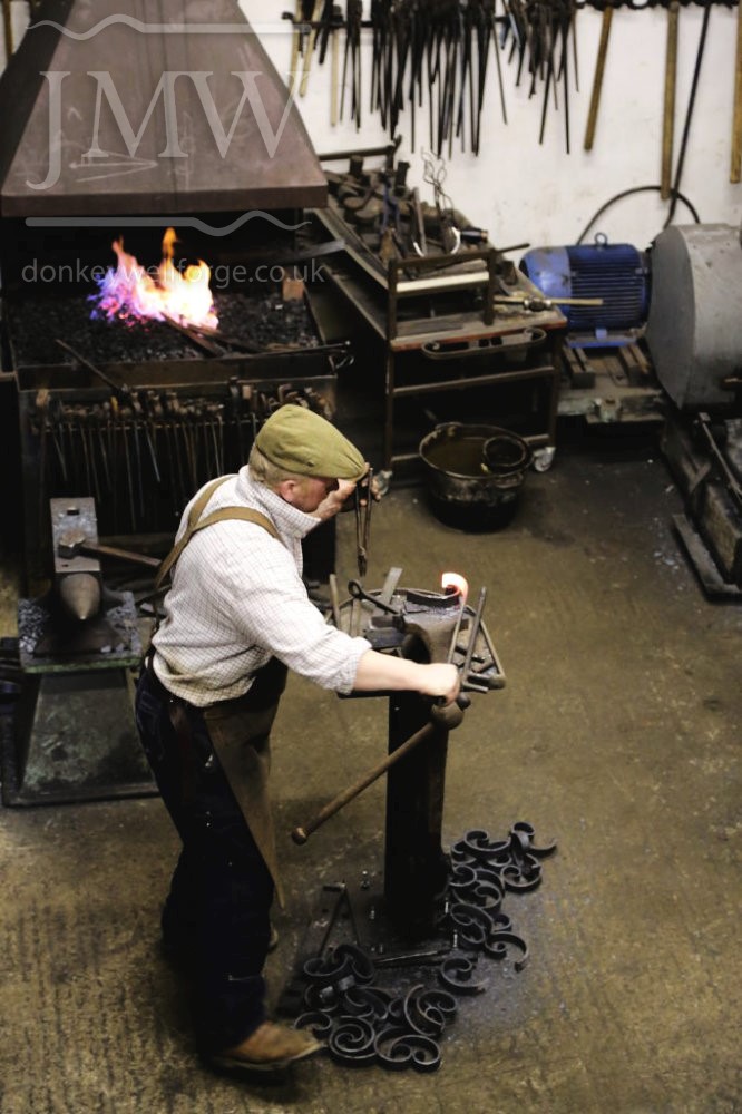 working-blacksmith-forge-ironwork-hammer-anvil