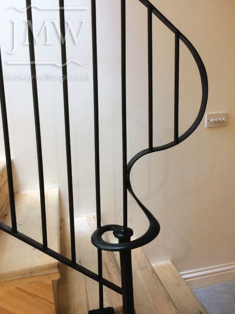bespoke-ornate-stair-handrail-iron-hand-riveted