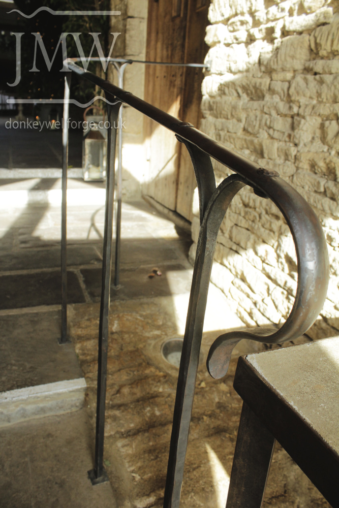 cripps-barn-wedding-venue-handrail-ornate-lead-bases-riveted-forged