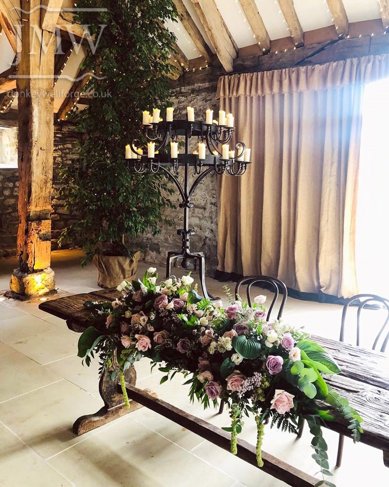 tithe-barn-standing-candelabra-wedding-venue-iron