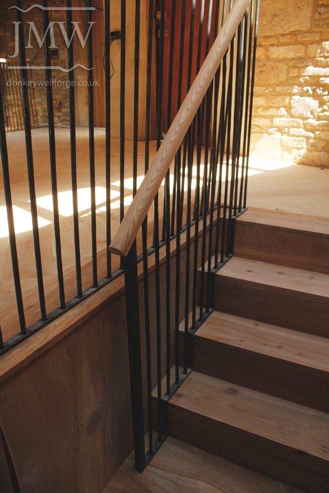 -country-house-forged-stair-balustrades-wooden-handrail