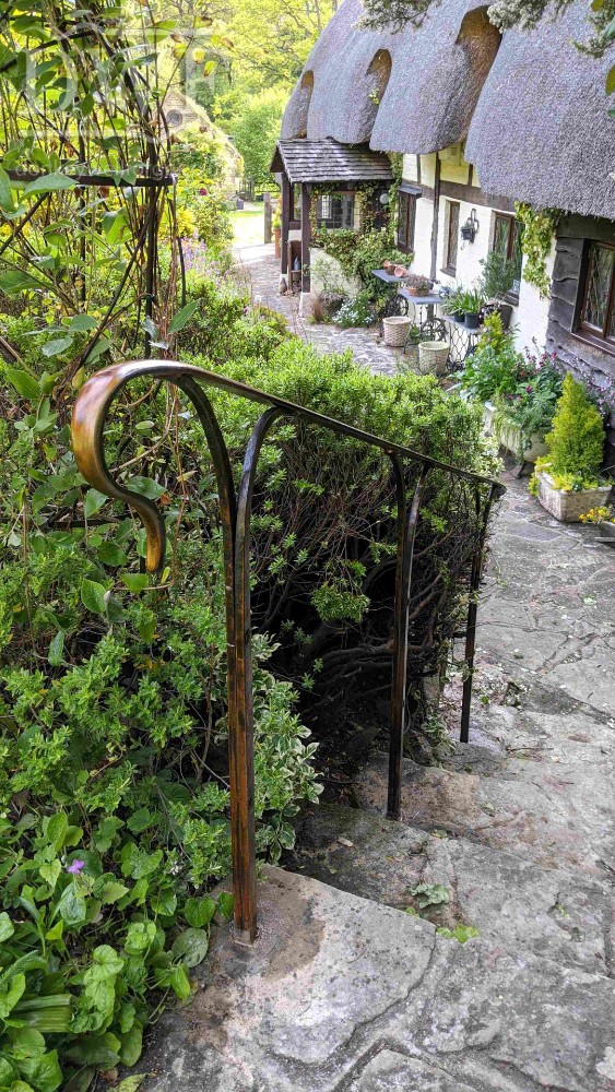 bronze-patina-handrail-forged-worked-iron-riveted