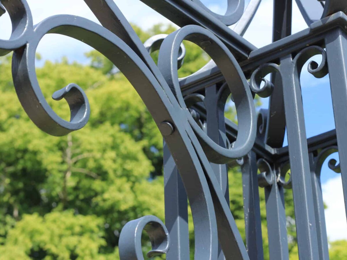 Cotswolds blacksmith casting railing arch forged