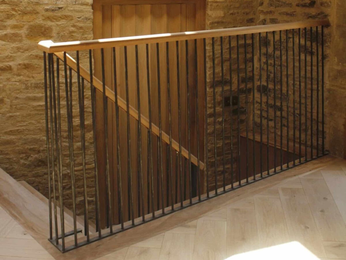 Cast iron railings for staircase by Donkeywell Forge